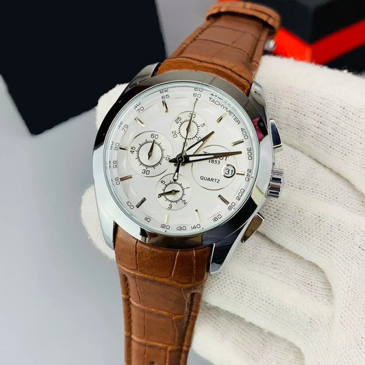 Watch with brown leather strap on a white background