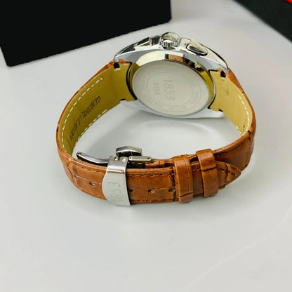 Watch with brown leather strap and silver case on a white background